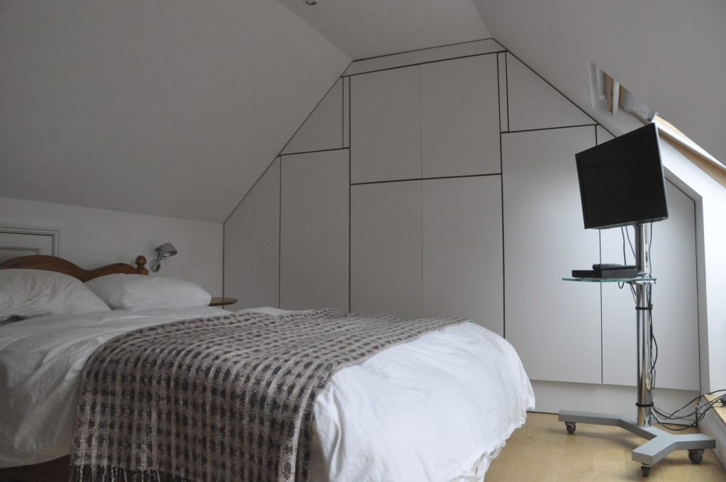 Attic Bedroom Painted Attic Room Wardrobes and walls painted in an off White grey palette